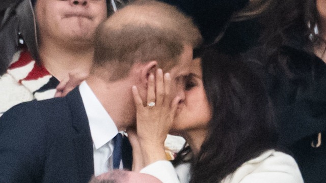 Prince Harry, Duke of Sussex and Meghan, Duchess of Sussex kiss during the opening ceremony of the 2025 Invictus Games