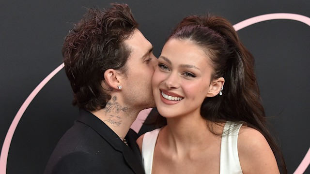 couple kissing at premiere 