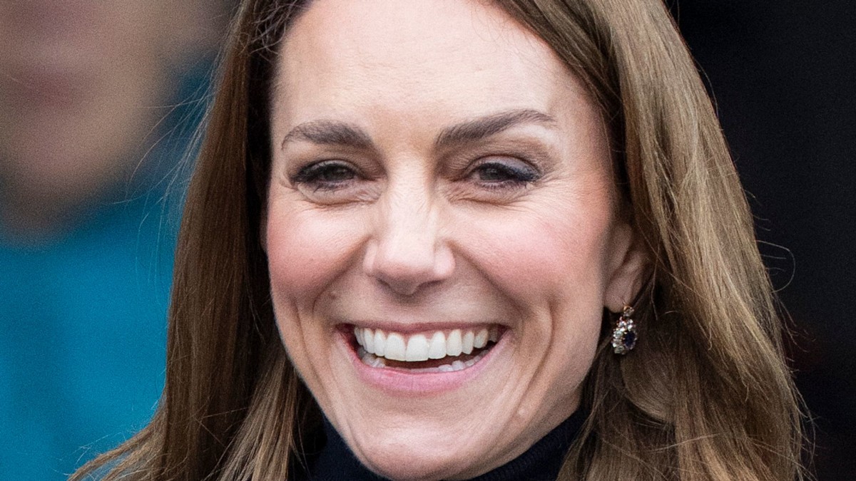 Princess Kate with softly curled, polished hair in a salon-like setting