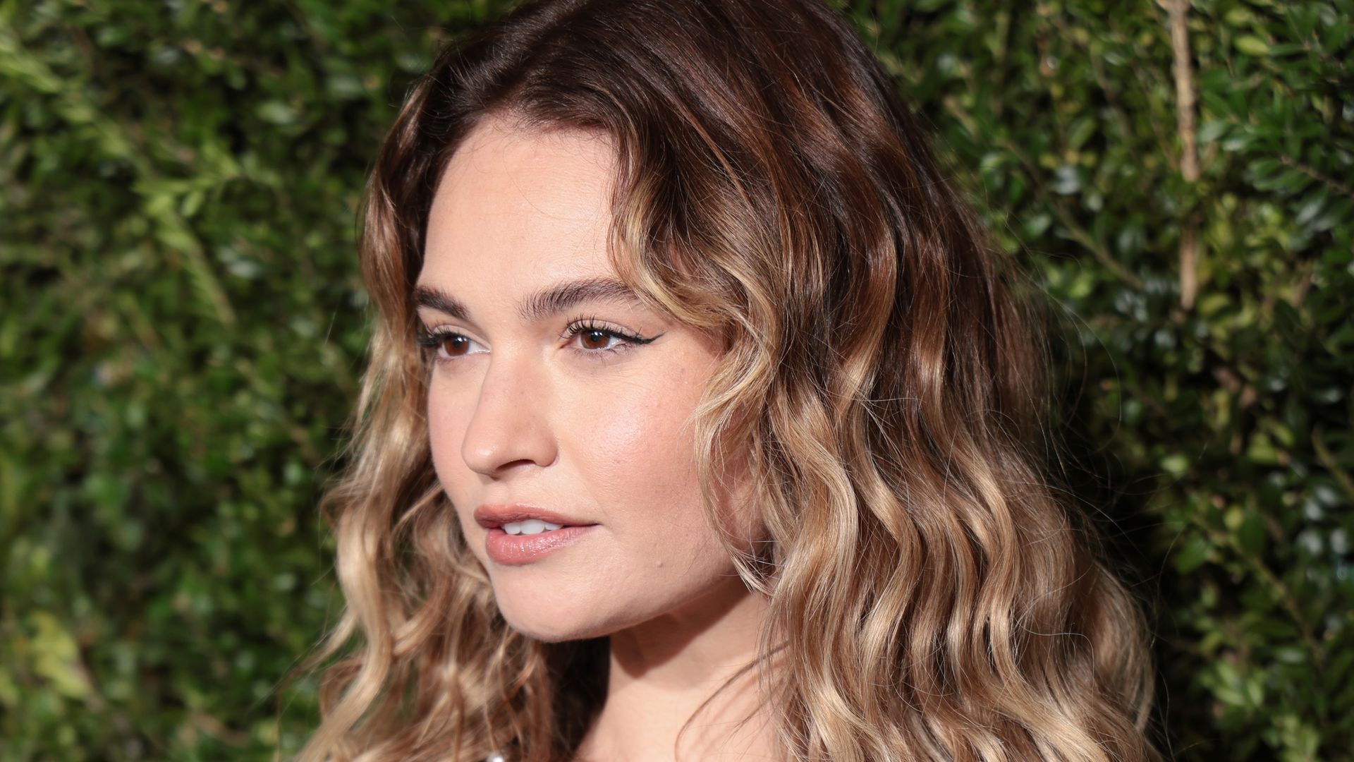 Lily James stuns in bikini on the beach as she shows off natural look in new photo