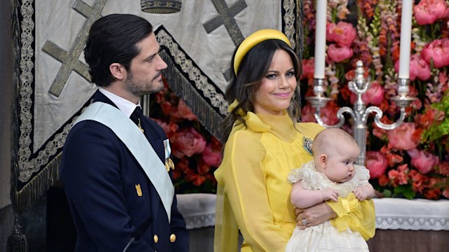 Princess Sofia in yellow outfit holding Princess Ines