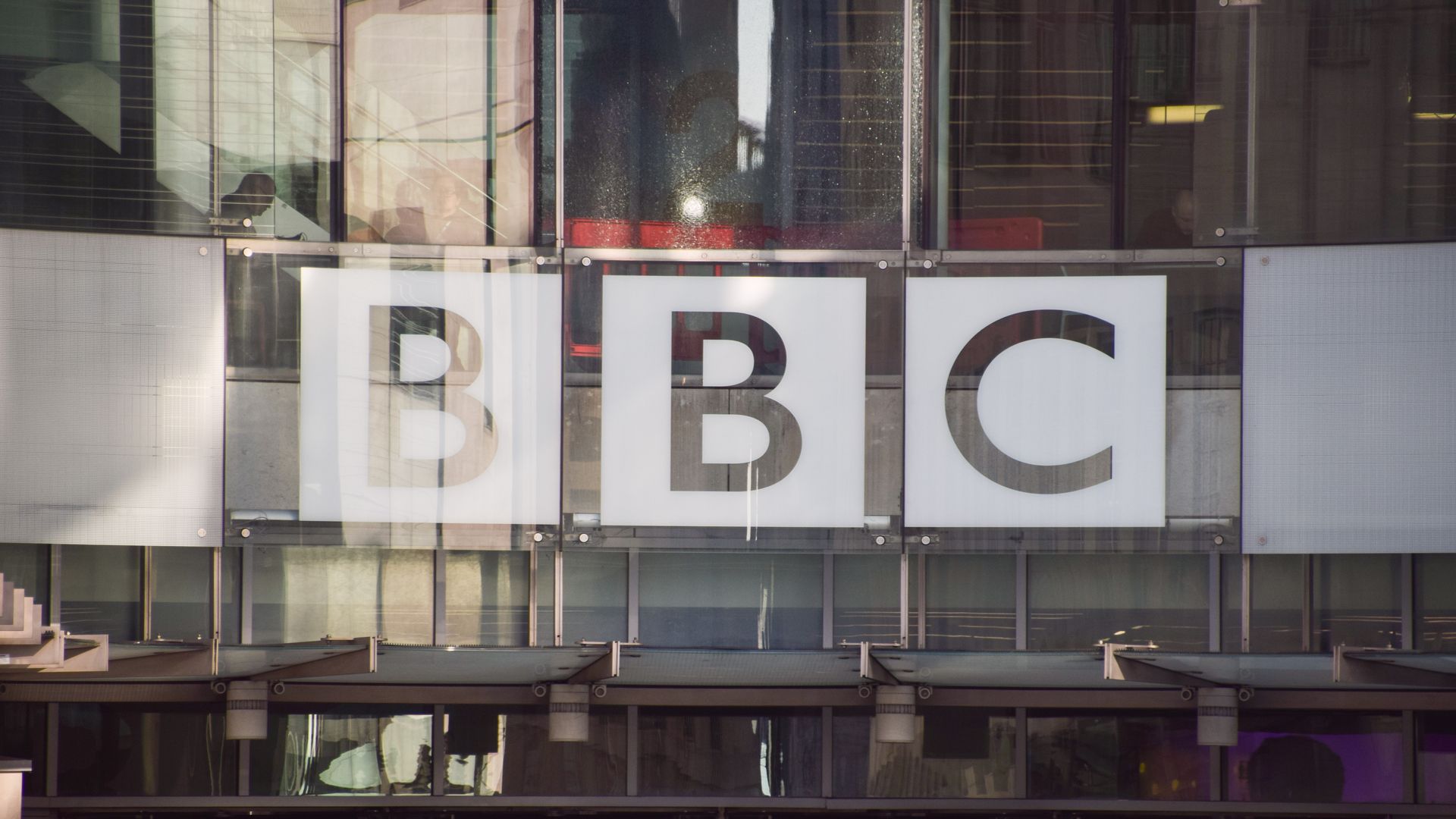 The BBC logo is seen at the entrance at Broadcasting House, the BBC headquarters in central London.