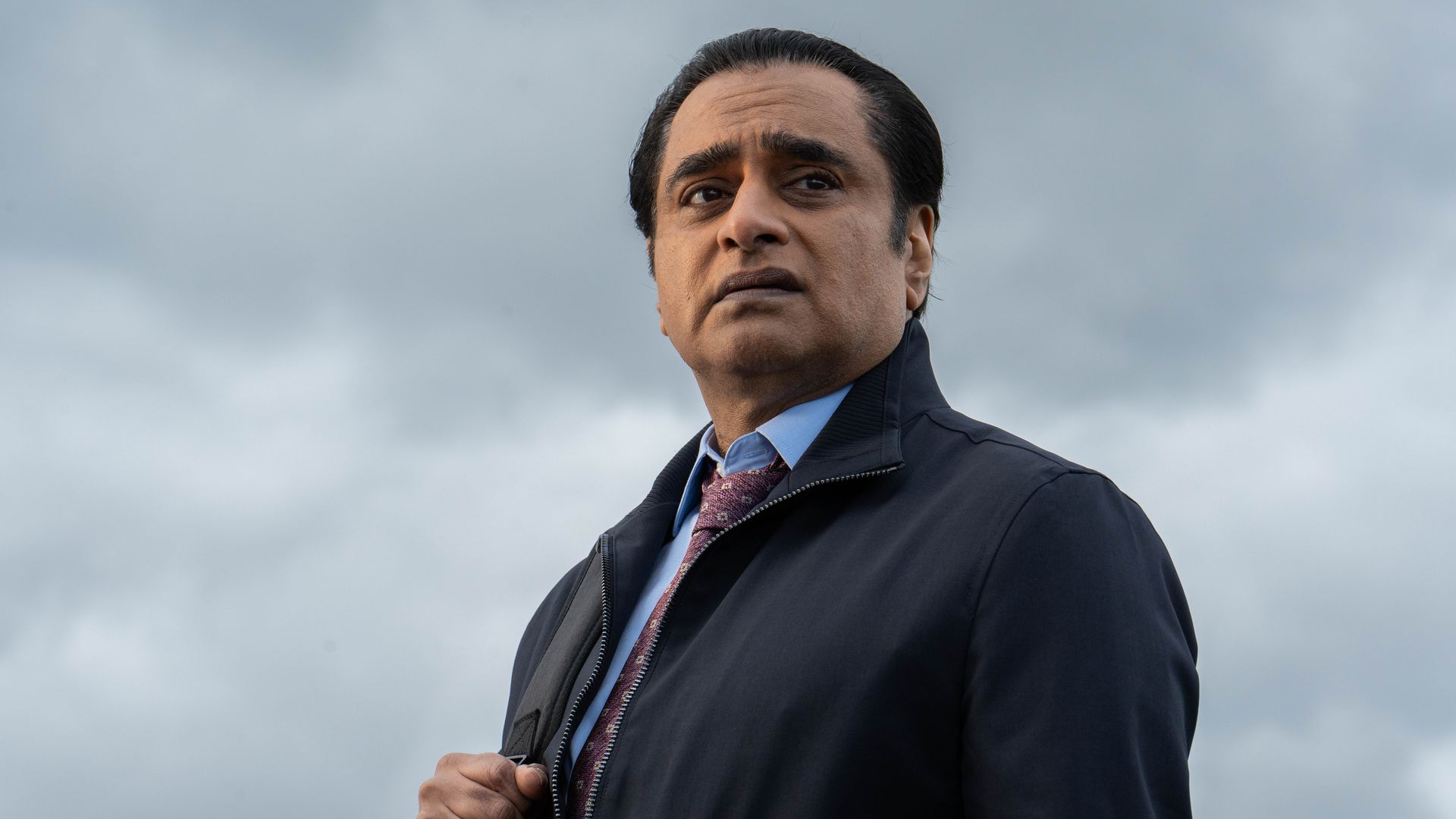 Man in suit looking into the distance