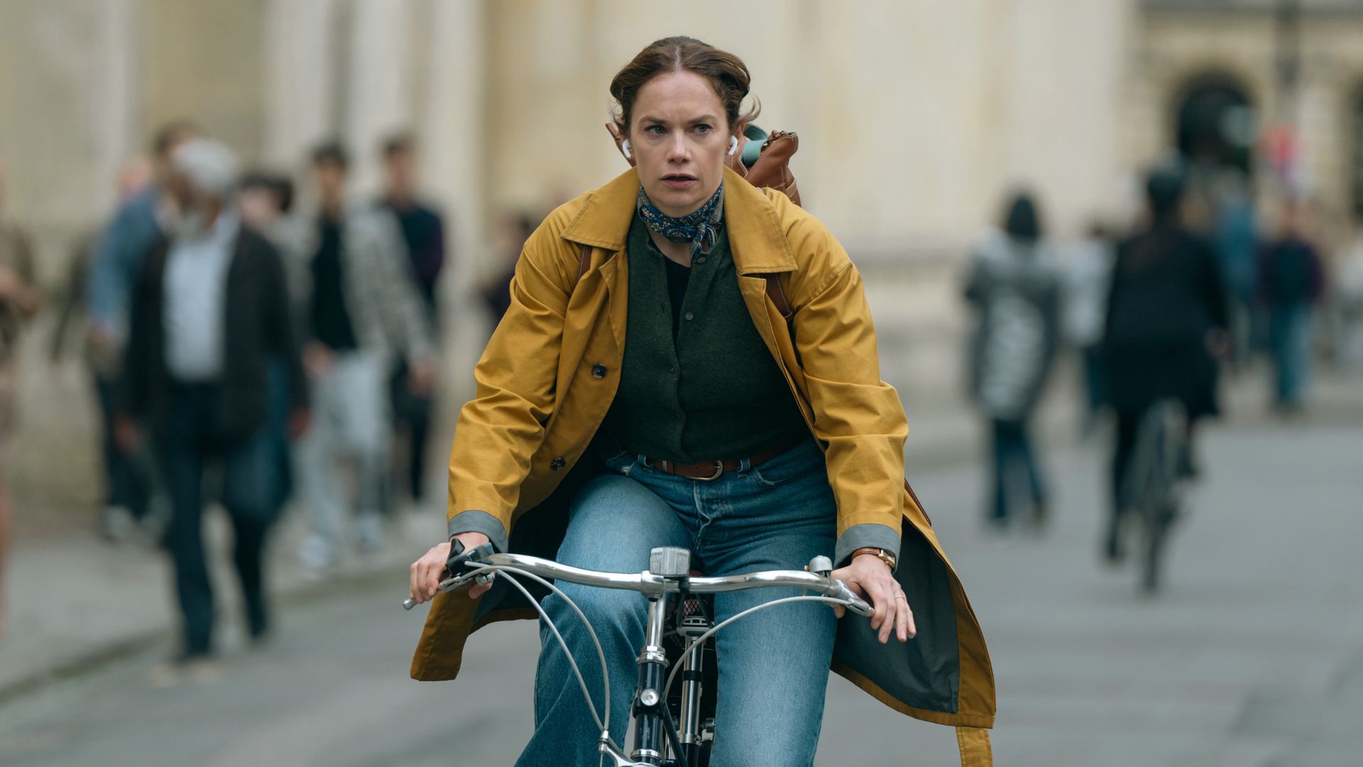 woman riding bike through town