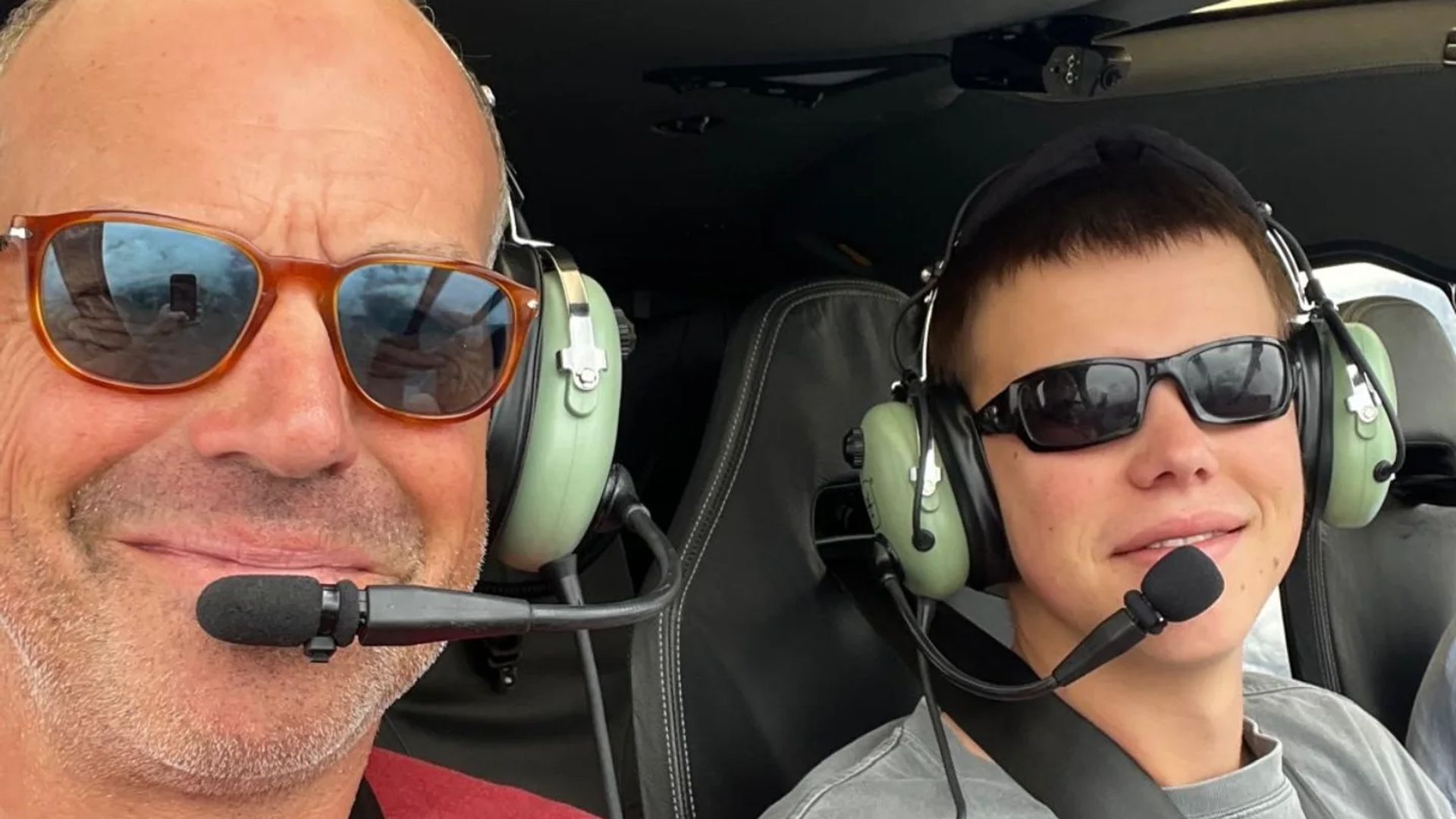 phil spencer in helicopter with son 