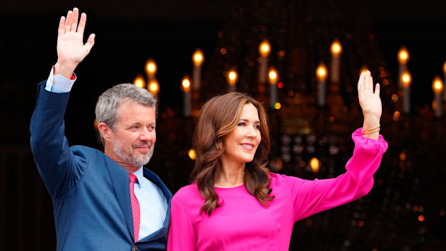 Queen Mary of Denmark (R) and King of Denmark Frederik X wave from the balcony on his 56th birthday at Frederick VIII's Palace, Amalienborg Castle, in Copenhagen, on May 26, 2024.