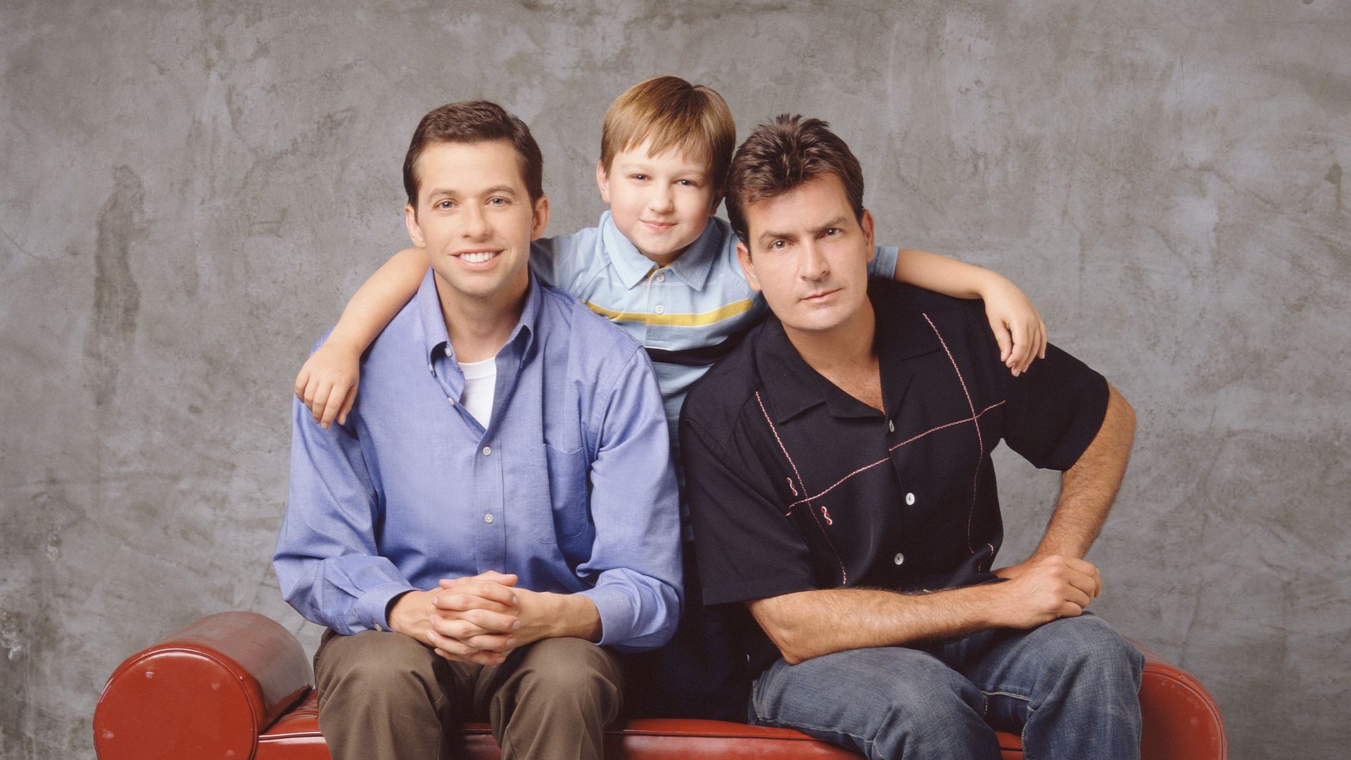 Promotional portrait of, from left, American actors Jon Cryer, Angus T. Jones, and Charlie Sheen for the television comedy 'Two and a Half Men,' Los Angeles, California, 2003. (Photo by E.J. Camp/CBS Photo Archive/Getty Images)