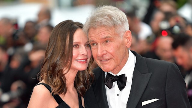 Calista Flockhart and Harrison Ford attend the "Indiana Jones And The Dial Of Destiny" red carpet during the 76th annual Cannes film festival at Palais des Festivals