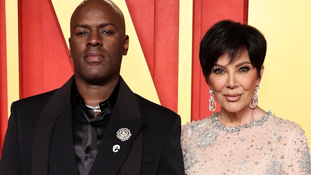 Corey Gamble in a black suit and Kris Jenner on the red carpet