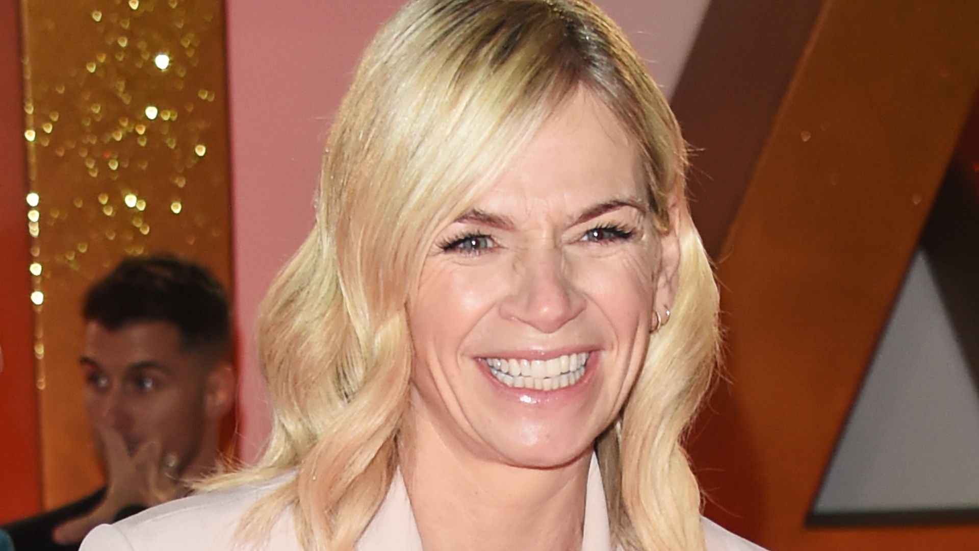  Zoe Ball in a pale pink suit laughing as she's pictured at the National Television Awards