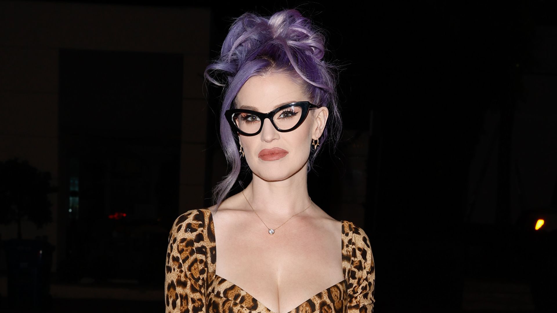 Kelly Osbourne can't keep the smile off her face as rocks bikini for pool day with son