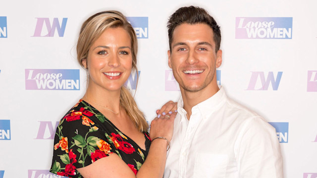 Gemma Atkinson in a floral dress with Gorka Marquez in a white shirt