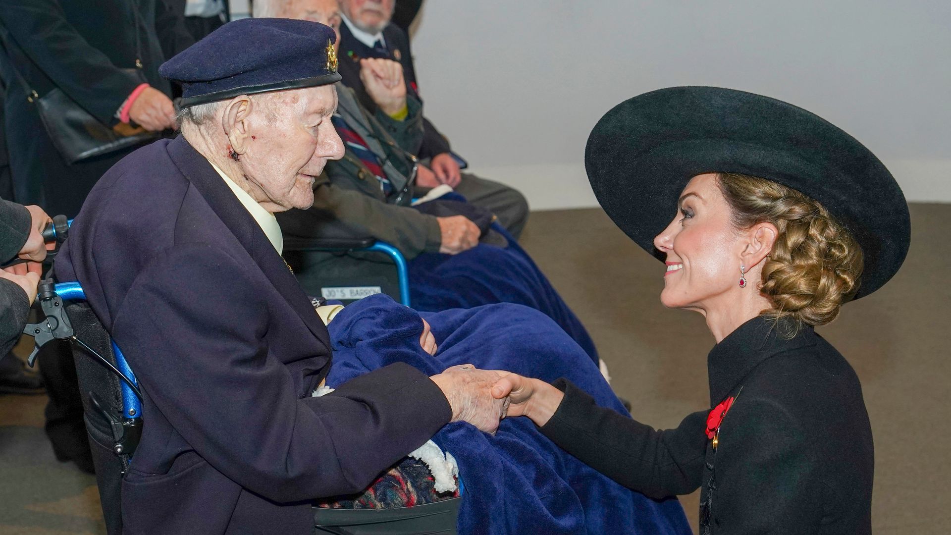 Princess Kate speaks with veterans during an Armistice Day service at The National Memorial Arboretum     