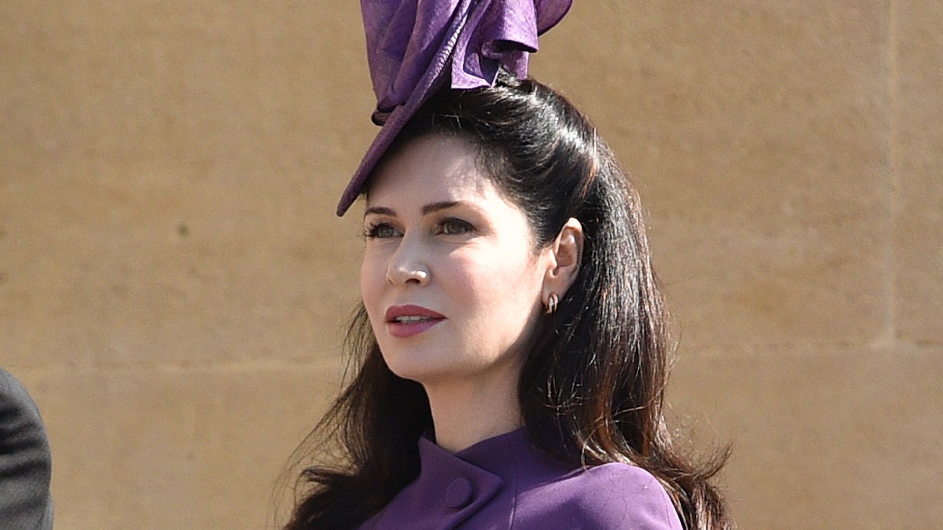 Karen Spencer walking in a purple dress