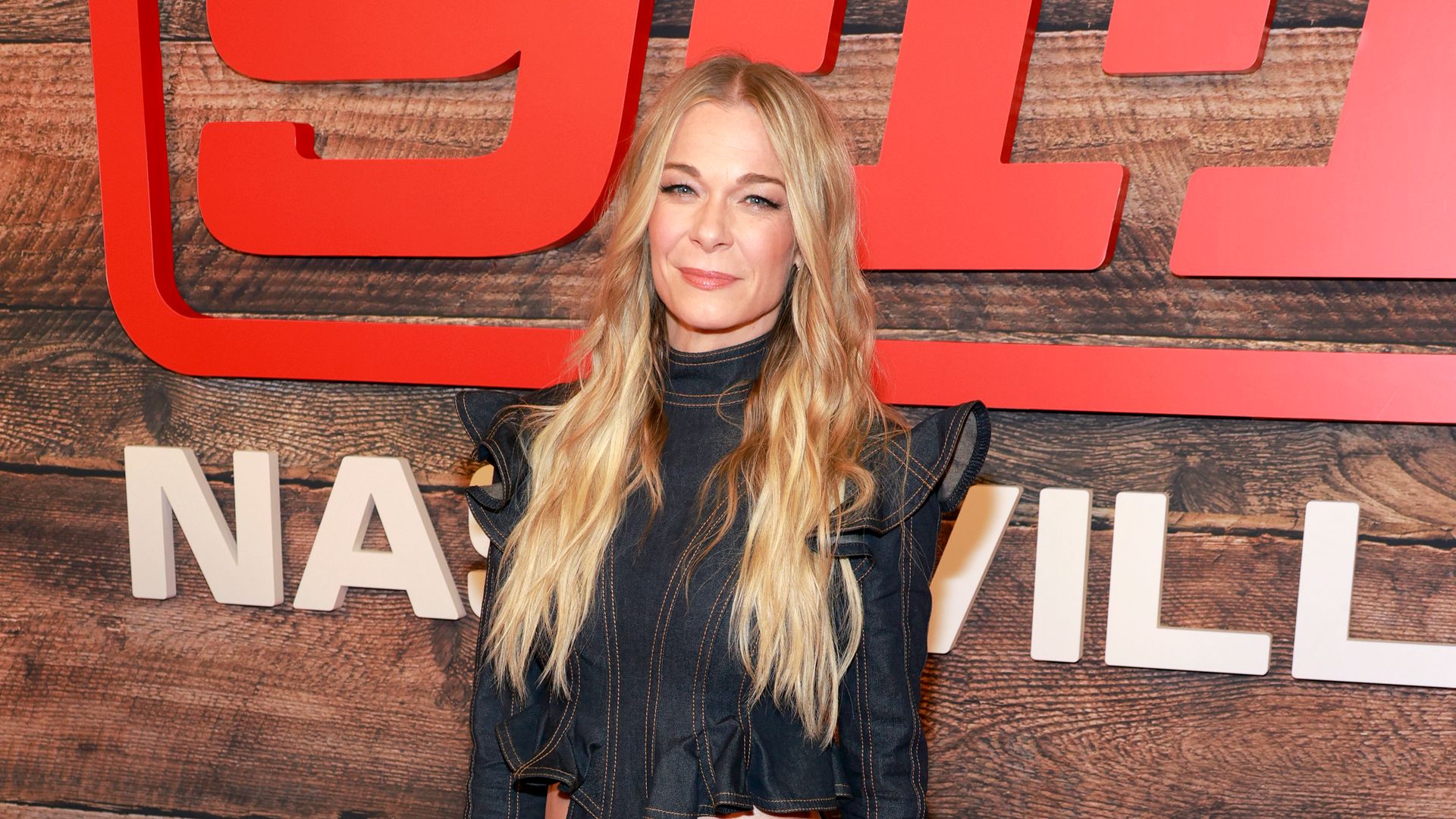 LeAnn Rimes on red carpet in dark denim dress