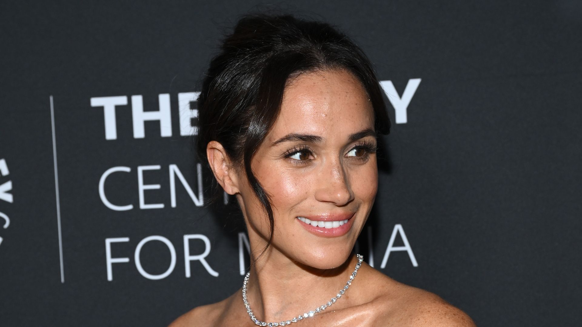 Meghan Markle stuns in plunging, bridal-inspired dress for Instagram return