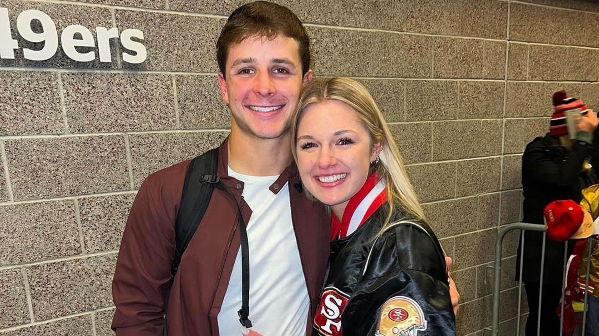 Jenna Brandt and Brock Purdy smiling together in December 2022