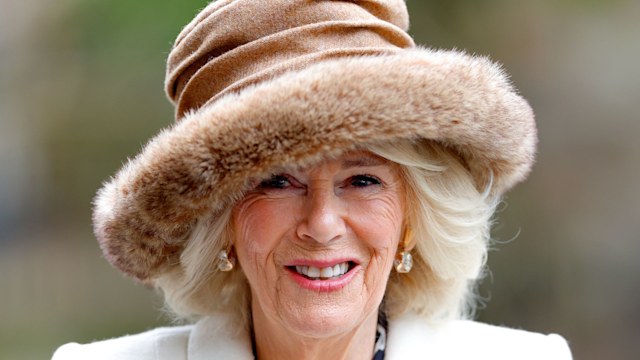 woman in white coat and brown fur hat