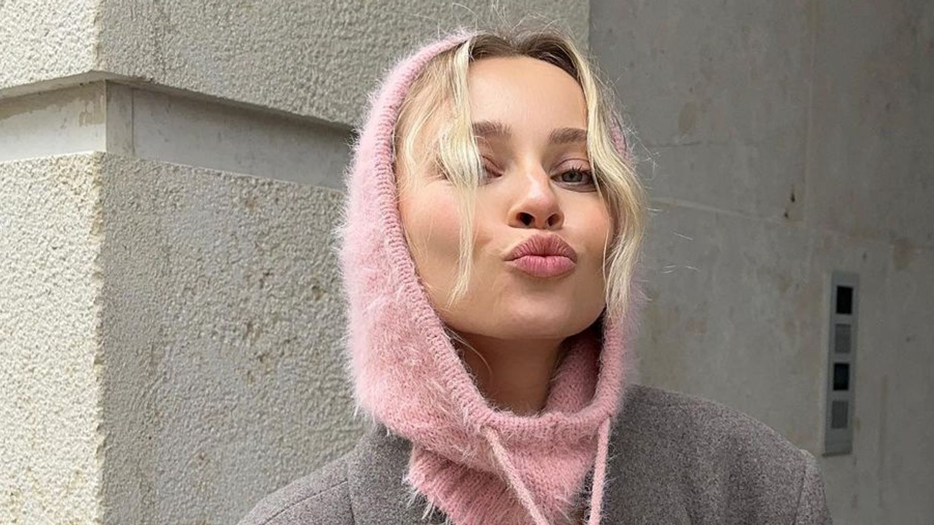 Instagram 'it' girl wears a baby pink balaclava, proving that we're right on trend