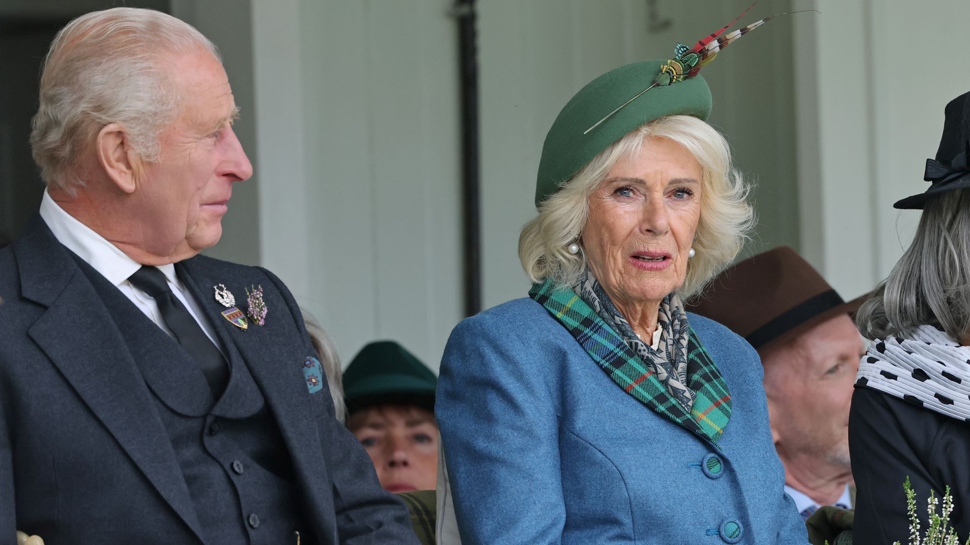King Charles sitting with Queen Camilla