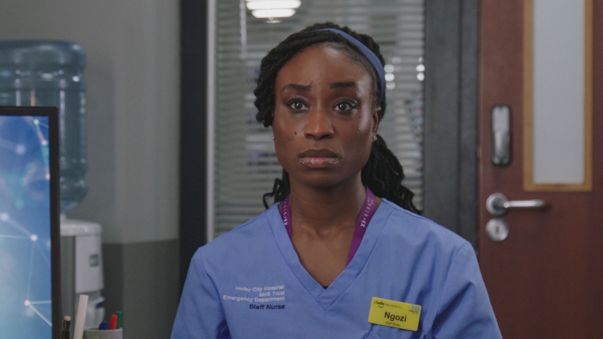 Adesuwa Oni as Ngozi Okoye in scrubs in Casualty