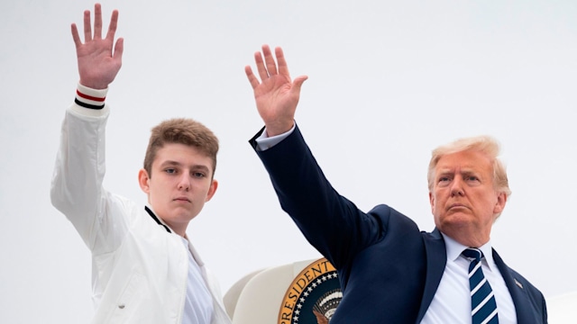 Donald Trump and his son Barron wave as they board Air Force One