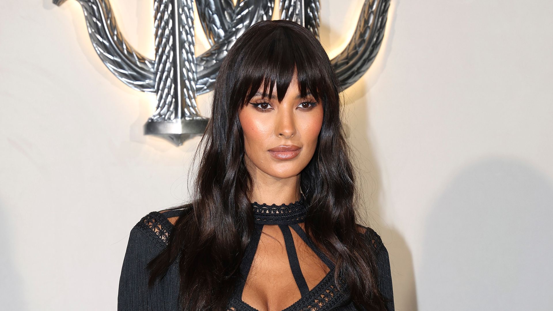 Maya Jama stuns in corset and chic micro fringe to promote upcoming secret project