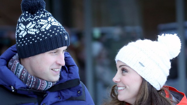 couple dressed in ski gear and bobble hats