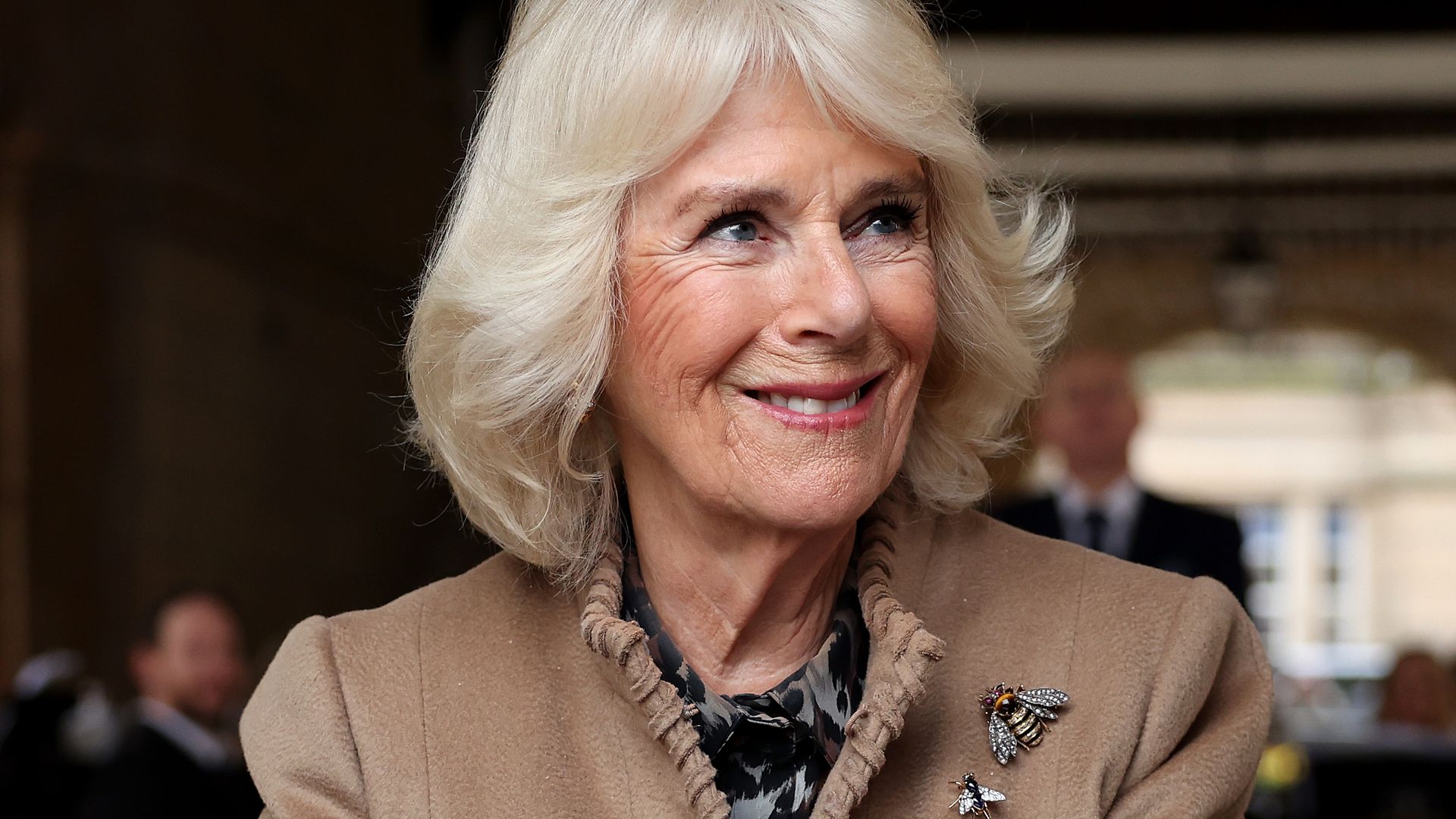 Queen Camilla smiles during her visit to the Farmers' Market on March 27, 2024 in Shrewsbury, England. 