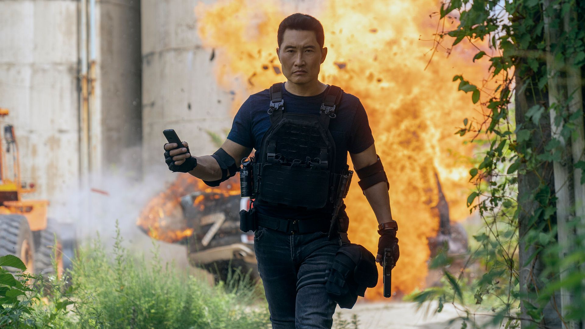 man walking away from explosion