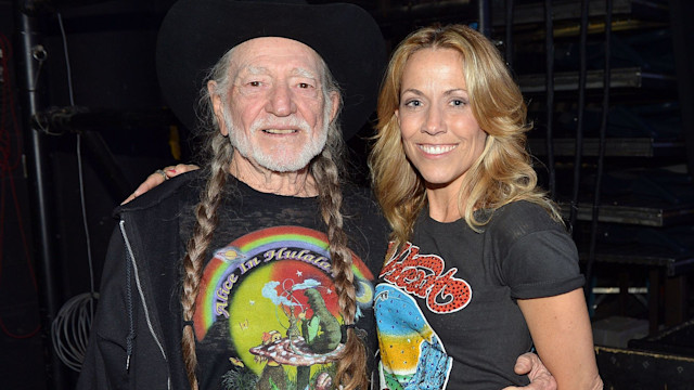 Willie Nelson and Sheryl Crow backstage during Keith Urban's Fourth annual We're All For The Hall benefit concert at Bridgestone Arena on April 16, 2013 in Nashville, Tennessee