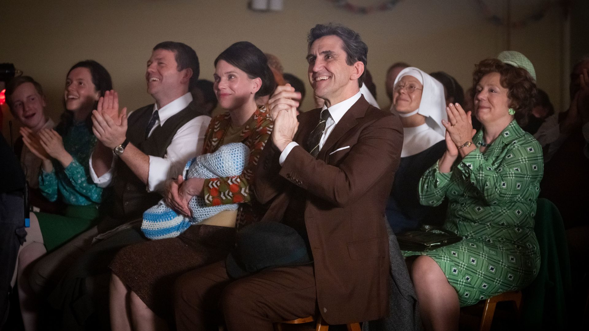 Stephen McGann as Dr Patrick Turner, Jenny Agutter as Sister Julienne and Annabelle Apsion as Violet Buckle in the Christmas Special. They are all clapping. 