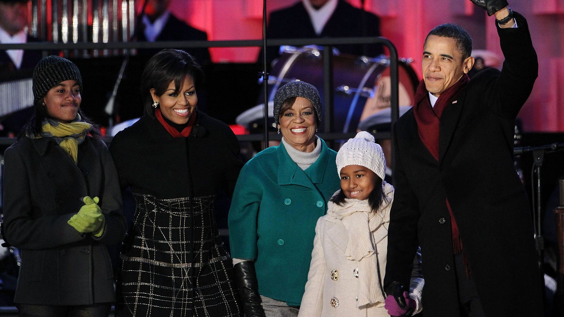 U.S. President Barack Obama (R) waves as he arrives with his daughters Sasha (4th L) and Malia (L), mother-in-law Marian Robinson (3rd L), and first lady Michelle Obama (2nd L) at the 2010 National Christmas Tree lighting ceremony December 9, 2010 at the Ellipse, south of the White House, in Washington, DC. The first family participated in the annual ceremony to kick off the 2010 National Christmas Tree Festival.