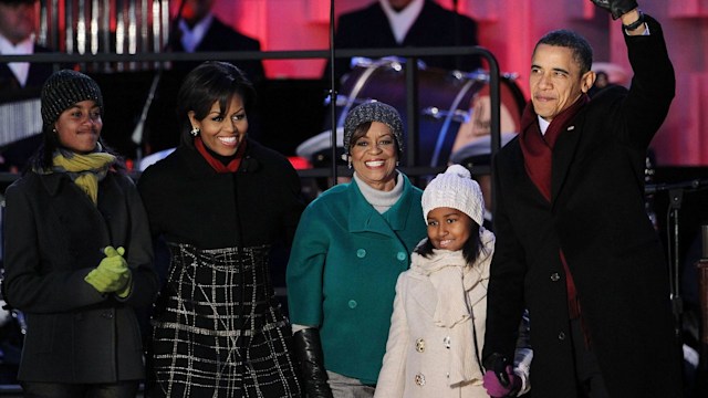 U.S. President Barack Obama (R) waves as he arrives with his daughters Sasha (4th L) and Malia (L), mother-in-law Marian Robinson (3rd L), and first lady Michelle Obama (2nd L) at the 2010 National Christmas Tree lighting ceremony December 9, 2010 at the Ellipse, south of the White House, in Washington, DC. The first family participated in the annual ceremony to kick off the 2010 National Christmas Tree Festival.