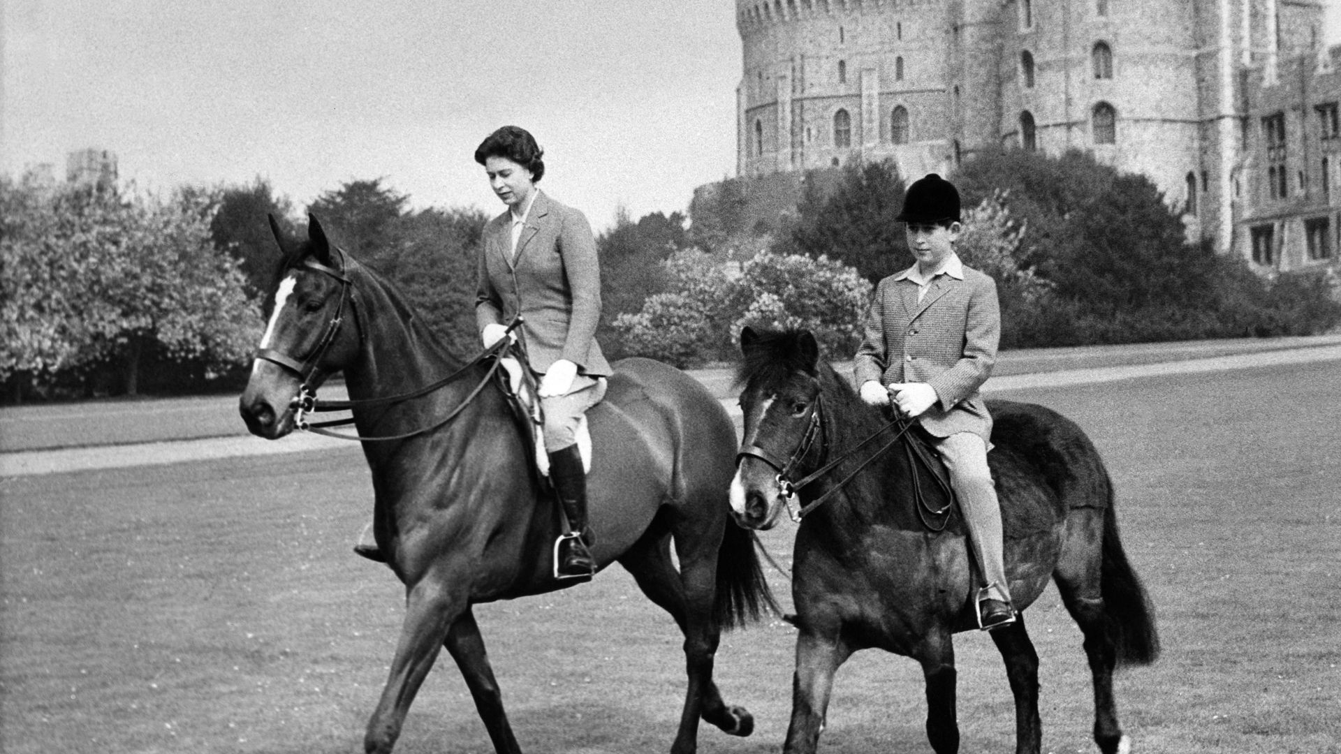 Queen Elizabeth II of England and Prince Charles sweetly rode in the park of Windsor Castle together