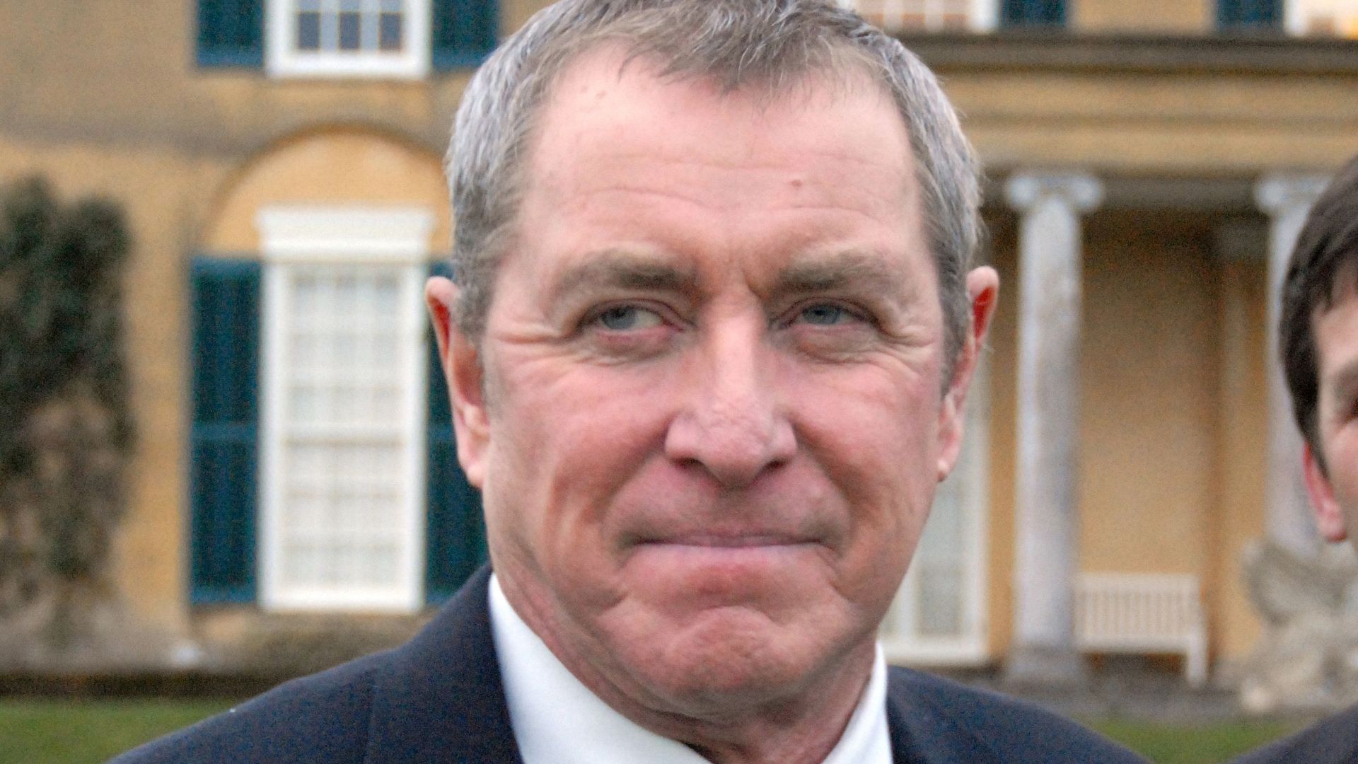 John Nettles in a striped tie and suit
