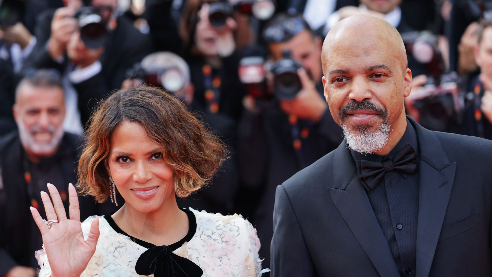 Halle Berry in white dress and Van Hunt in black suit 