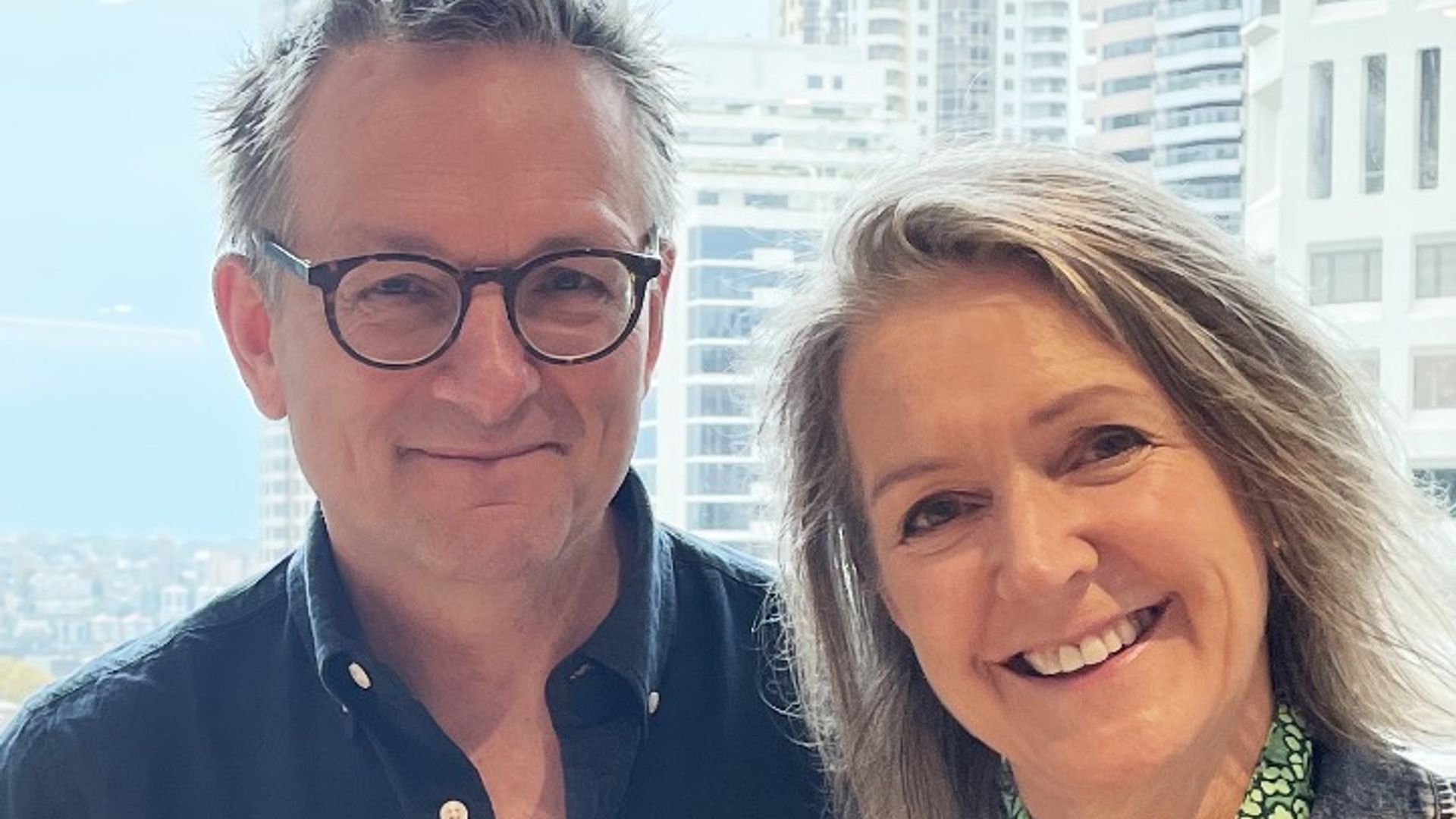 michael mosley standing by high window with wife