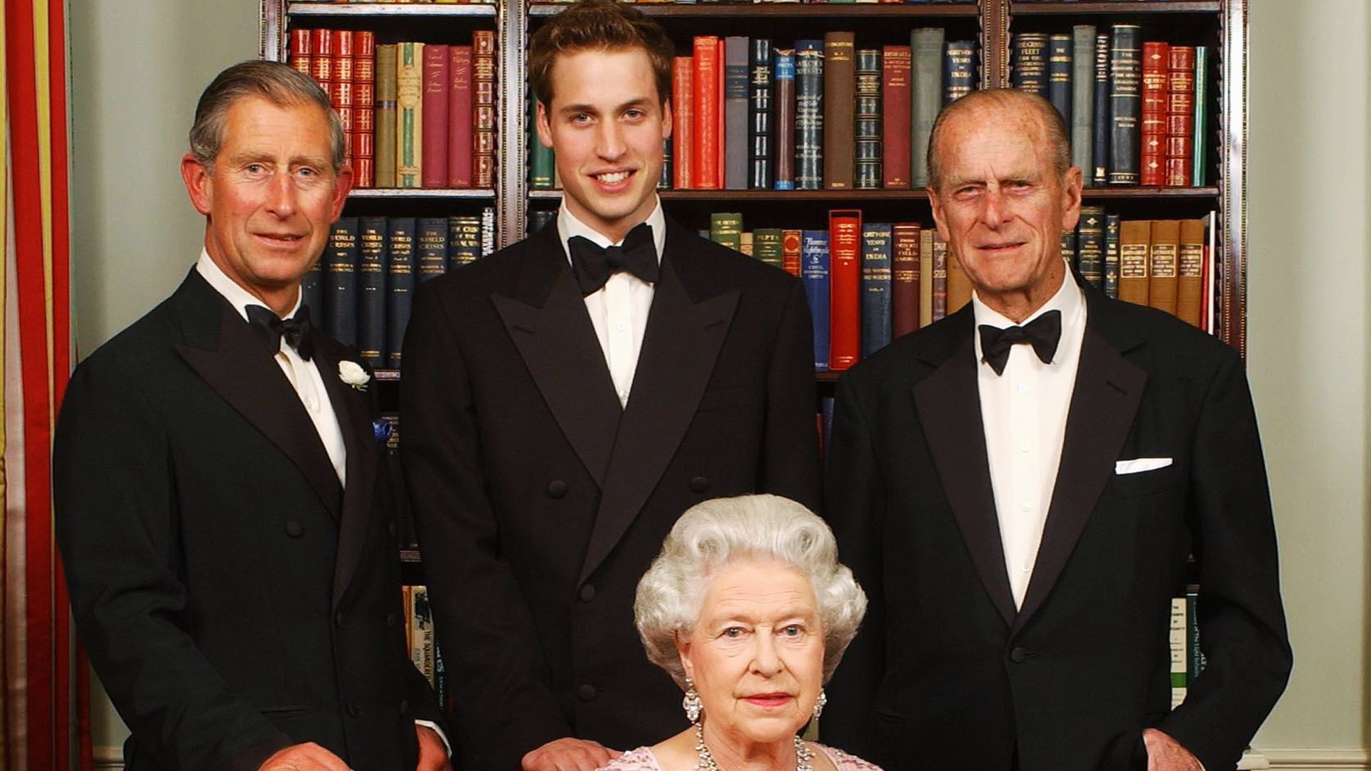 King Charles, Prince William and Prince Philip standing behind the Queen
