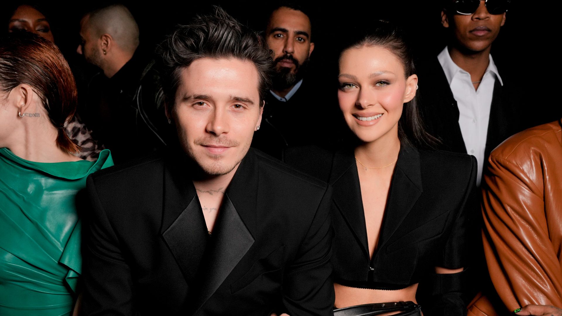 Brooklyn Beckham and Nicola Peltz smiling on the front row at Mugler's AW24 show 