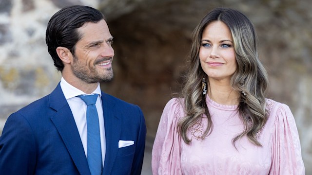 Prince Carl Philip smiling at Princess Sofia in pink dress