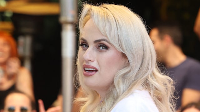 Rebel Wilson looking glamorous in a white top