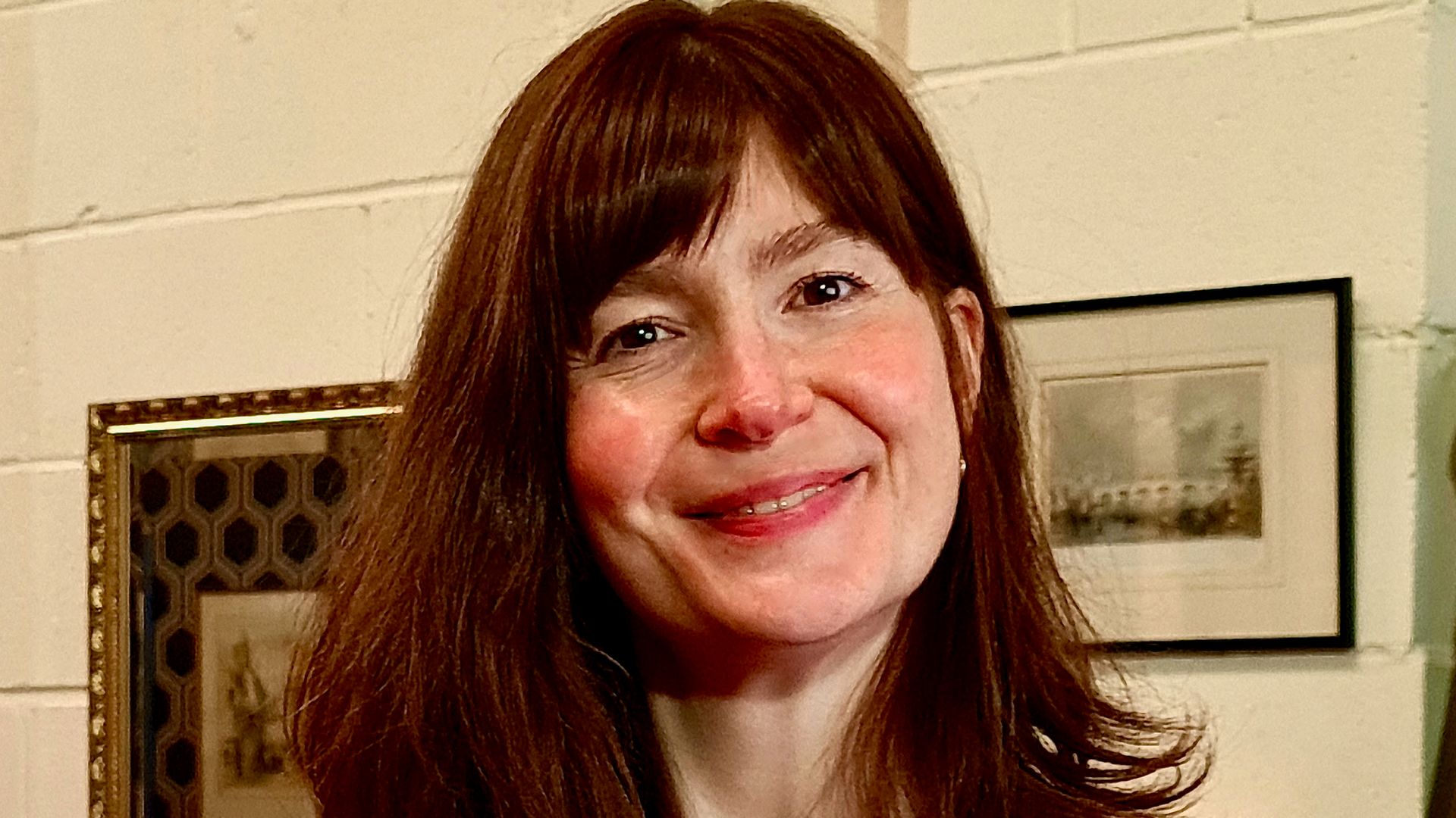 female presenter in antique shop