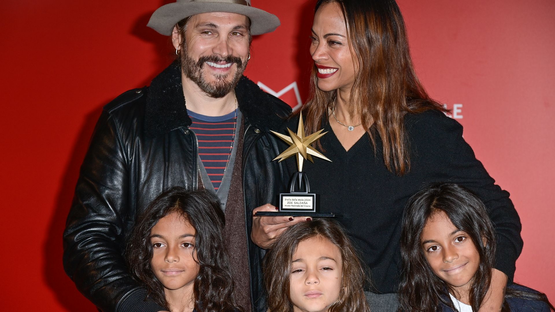 Zoe Saldana makes rare red carpet appearance with her three lookalike sons and husband