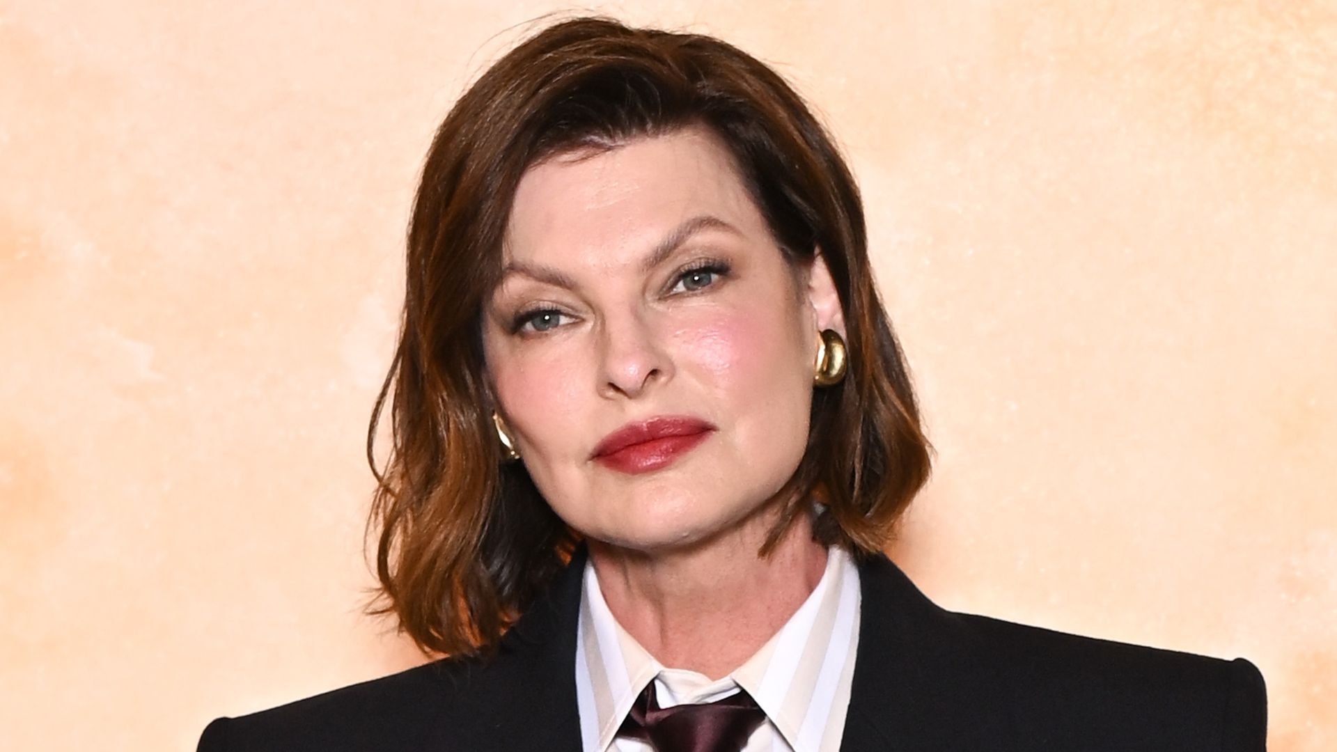 Linda Evangelista's rarely-seen son towers over her and famous stepmother - fans react