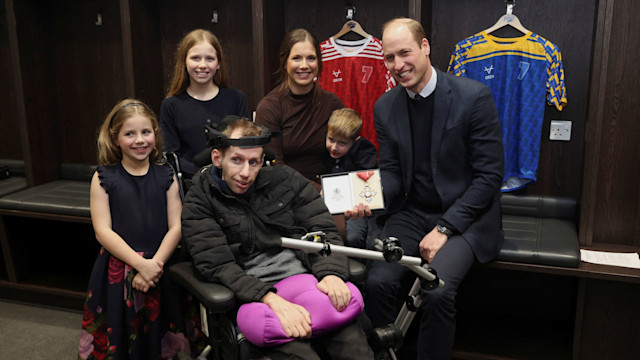 Prince William, Prince of Wales intervened so the couple’s children could see him present their dad with his CBE