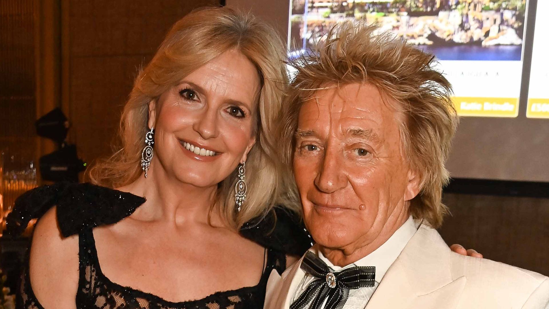 Penny Lancaster parties with Rod Stewart in form-fitting shimmery dress