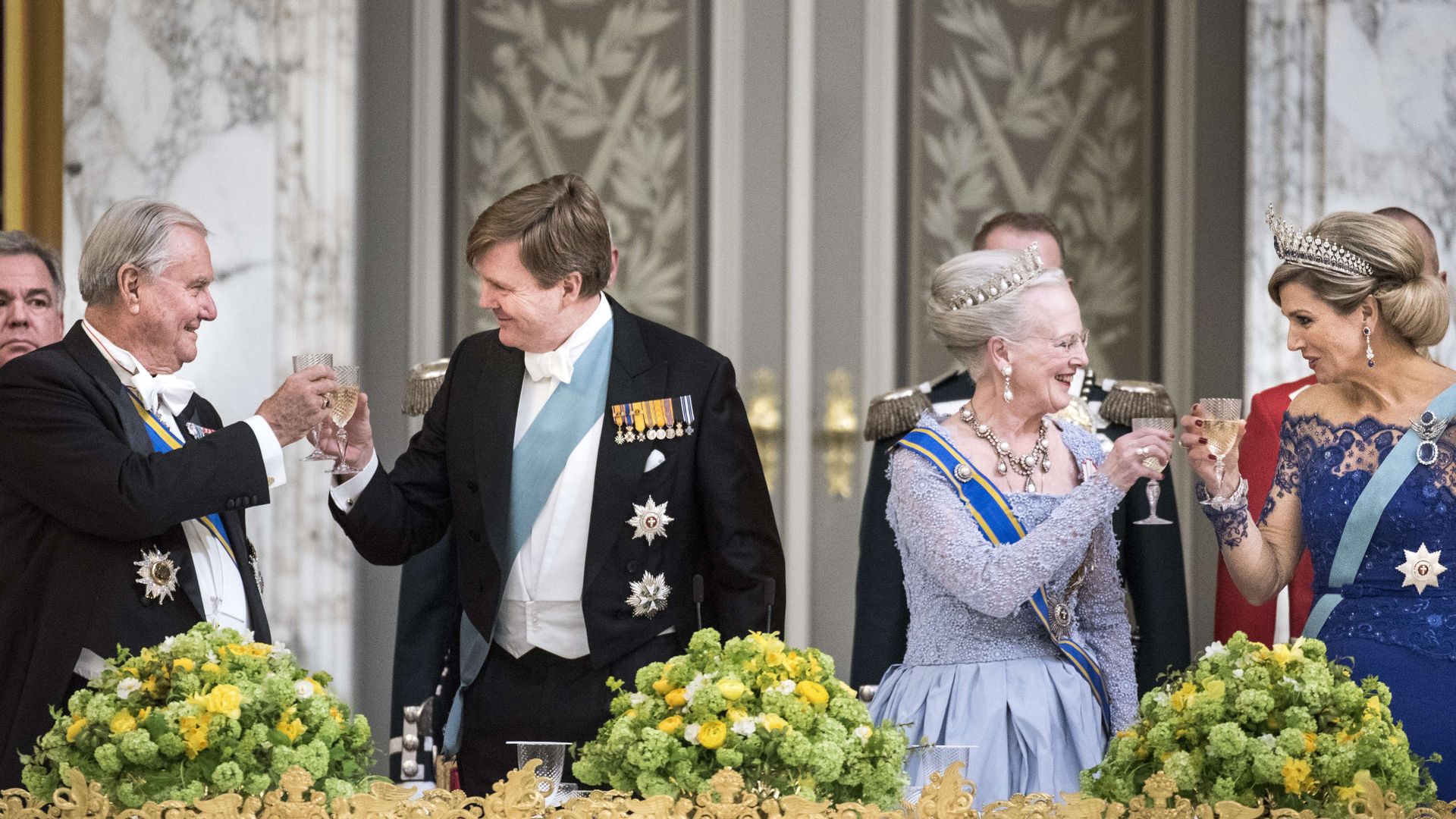 Queen Margrethe and Prince Henrik toasting with Queen Maxima and King Willem-Alexander