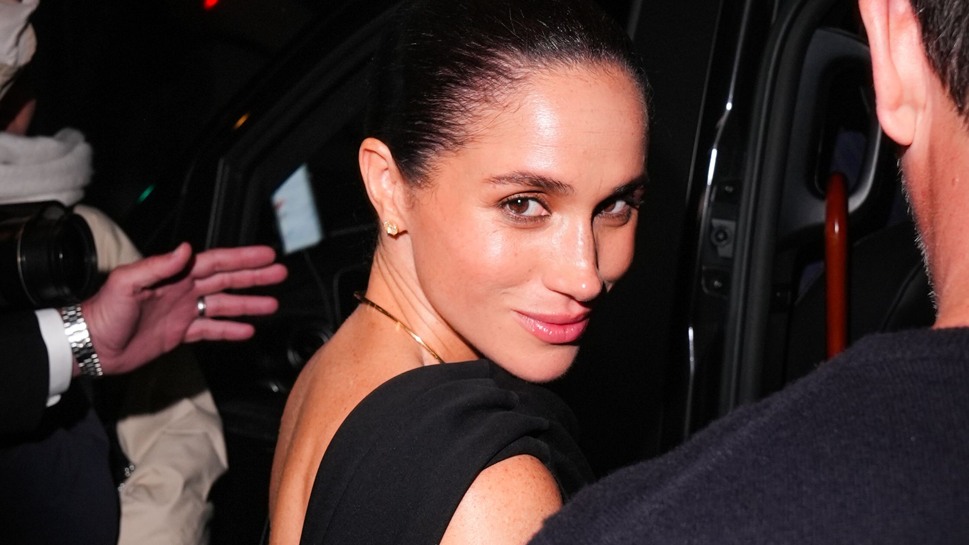 Meghan Markle is seen during the Womenswear Spring Summer 2026 as part of Paris Fashion Week with bun hairstyle