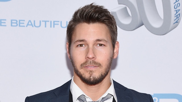 Scott Clifton in a blue suit